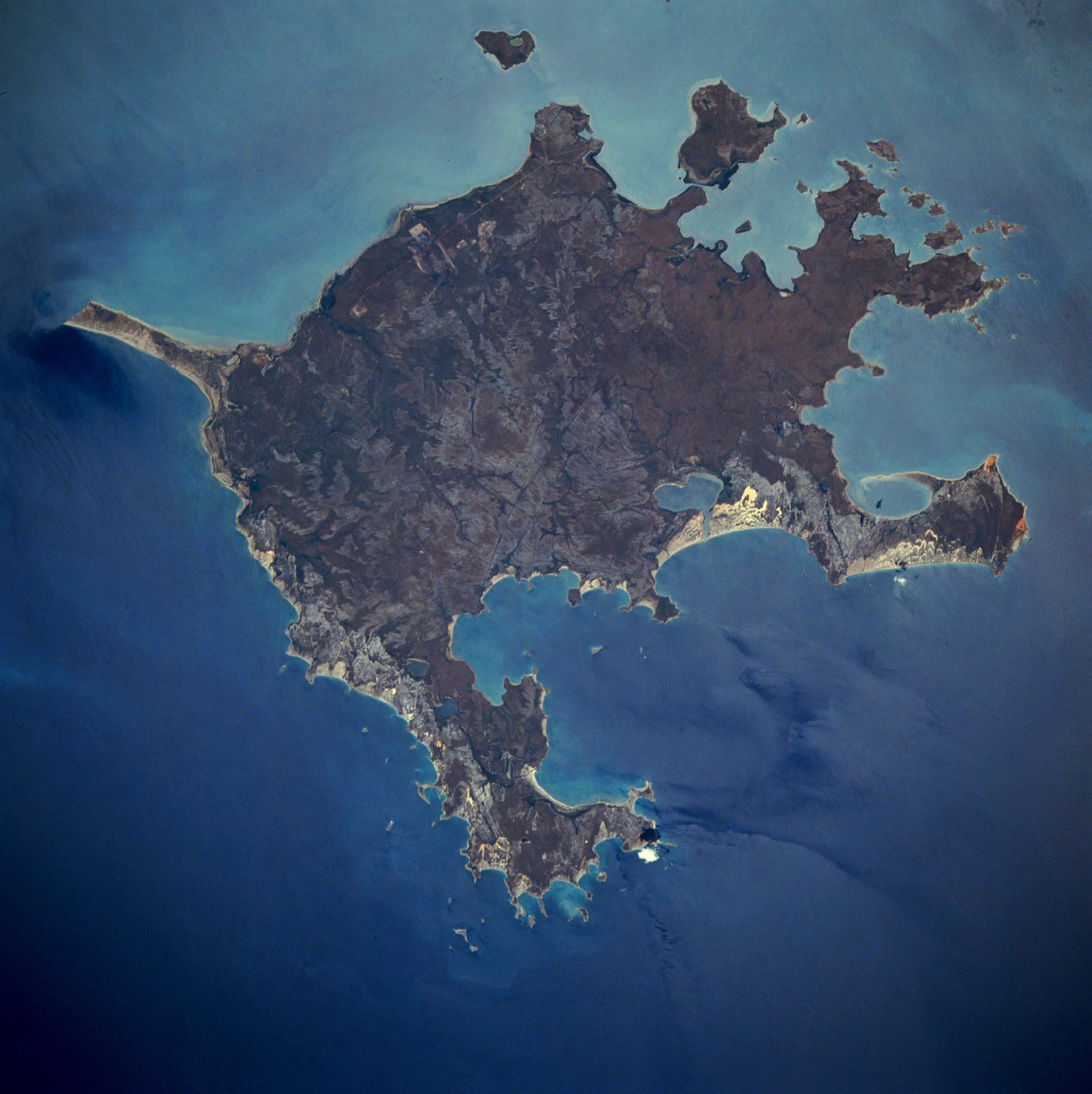Top-down satellite view of Groote Eylandt surrounded by dark blue ocean water.
