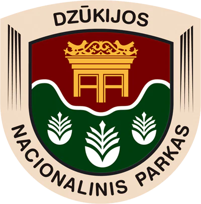Circular emblem with 'DZŪKIJOS NACIONALINIS PARKAS' text, red top section with golden structure, green lower section with three wheat symbols