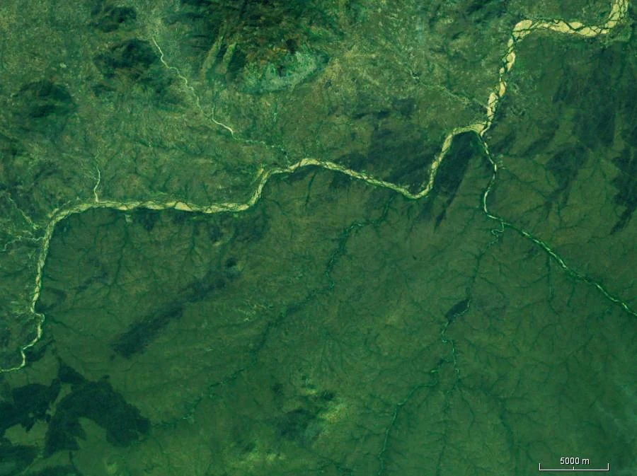 Satellite image showing the confluence of two rivers in Faro National Park, Cameroon, with surrounding green landscape