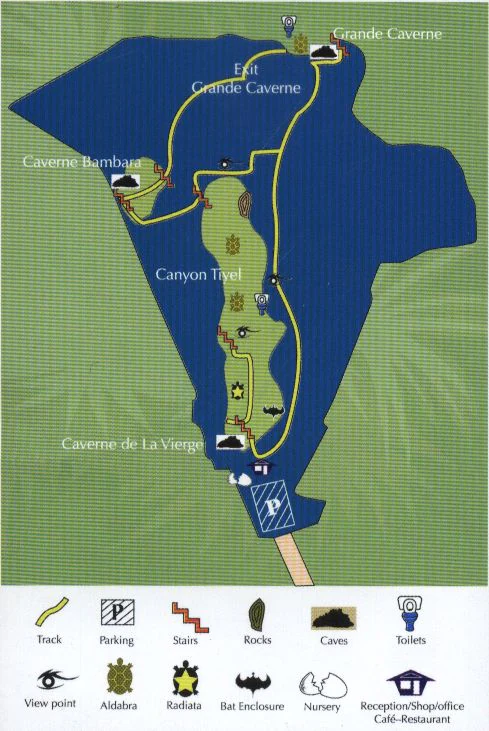 A diagrammatic park map of the François Leguat Giant Tortoise and Cave Reserve, displaying trails, cave locations, visitor facilities, and a legend with icons for tortoises and other landmarks.