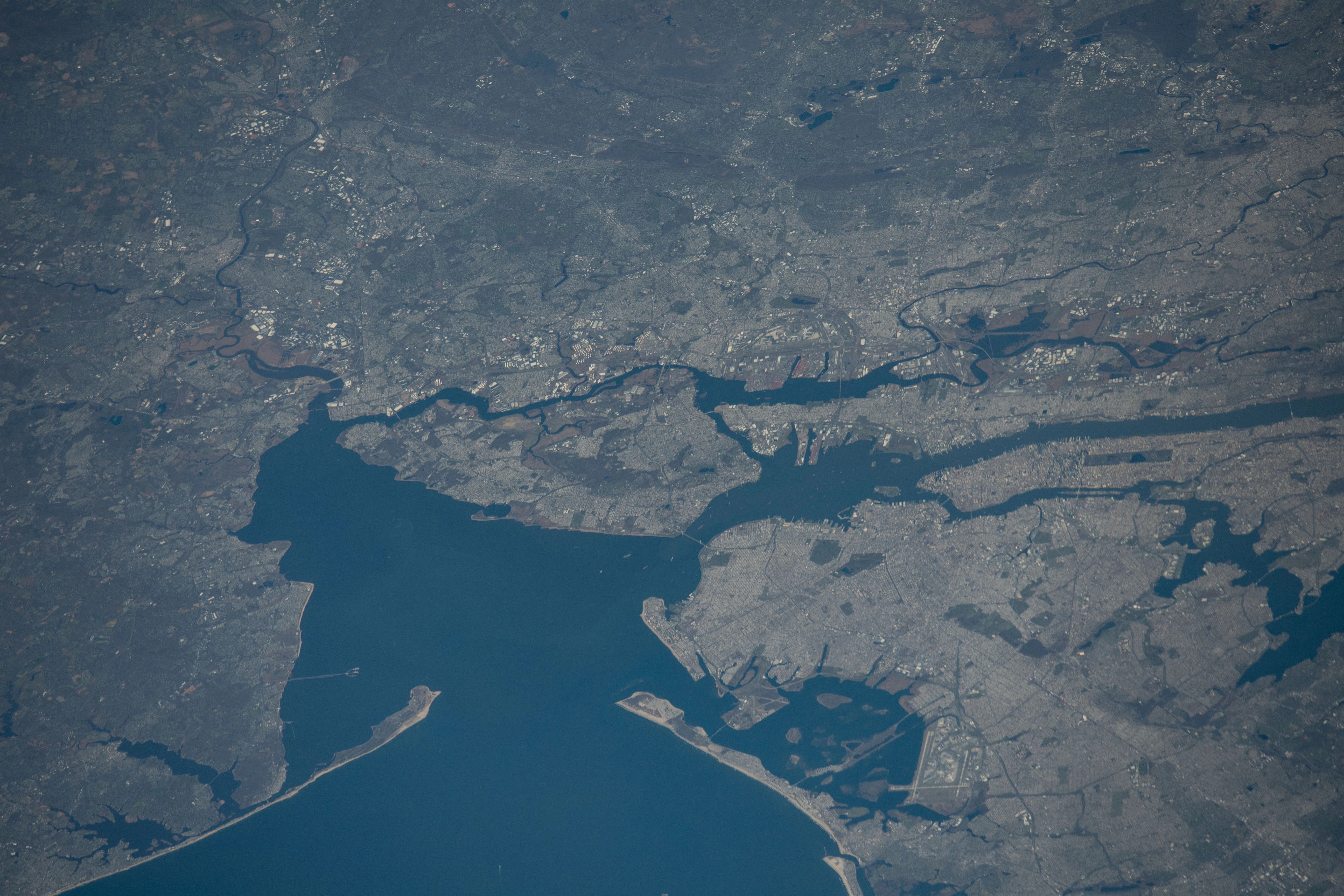 Satellite-style aerial view showing the intricate shoreline, bays, and urban-integrated coastal landscapes of the Gateway National Recreation Area.