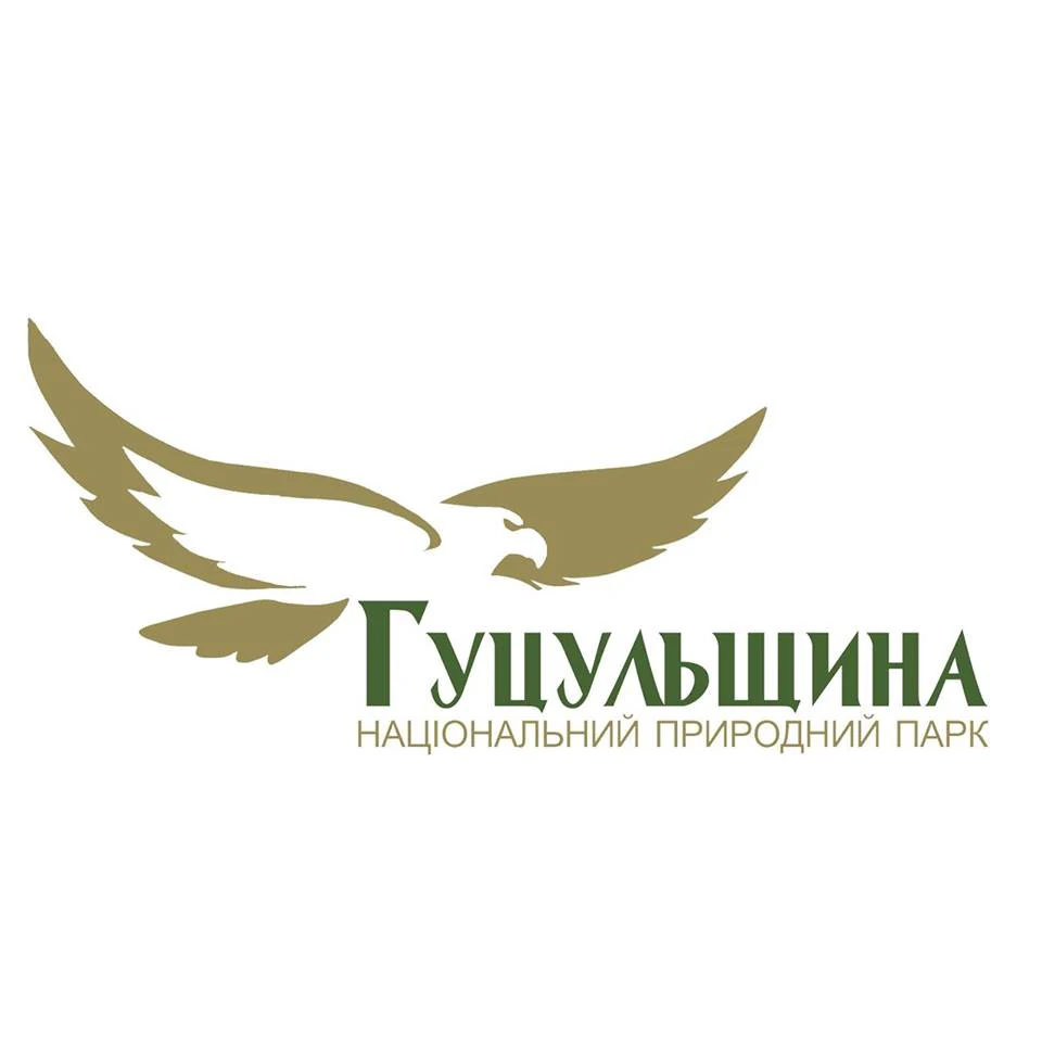 Gold and green emblem of Hutsulshchyna National Park with a stylized eagle design and Ukrainian text 'Гуцульщина НАЦІОНАЛЬНИЙ ПРИРОДНИЙ ПАРК'