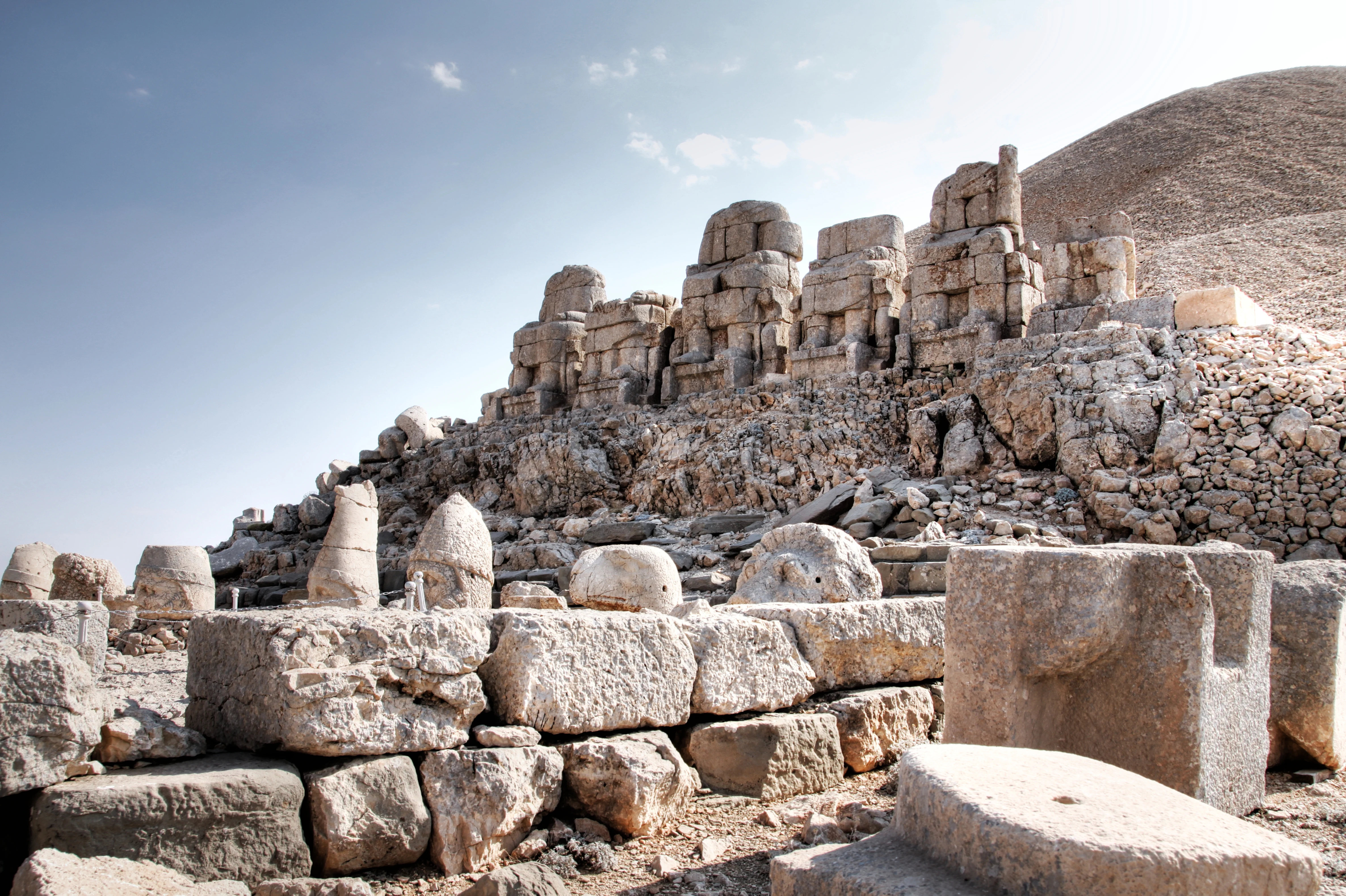 Stone ruins and ancient stone sculptures on a hilltop at Mount Nemrut National Park
