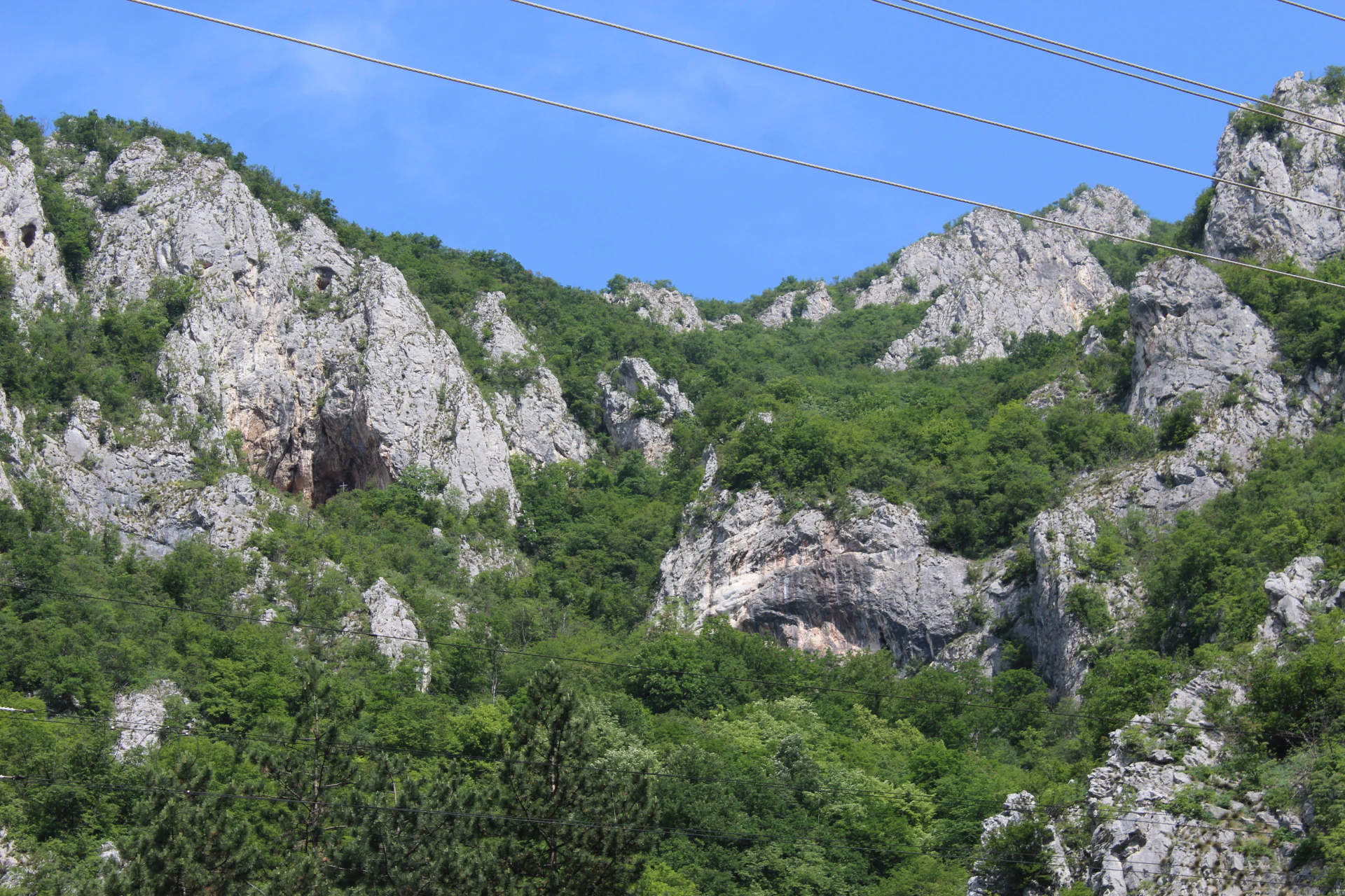 Rocky cliffs with vegetation and caves in Ovčar-Kablar Gorge