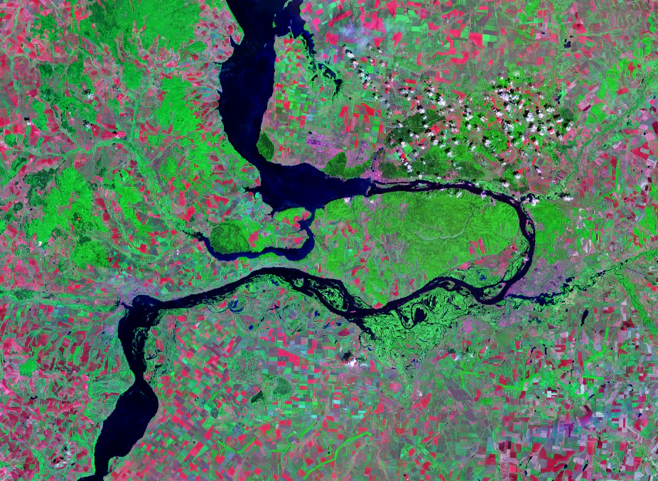 Satellite image showing the Samara Bend peninsula formed by the Volga River, with green landscapes, blue waterways, and urban areas