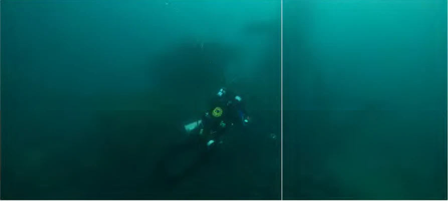 Una vista submarina de un buceador con una luz brillante examinando los restos oscuros y sumergidos de un naufragio de madera en el lago Míchigan.